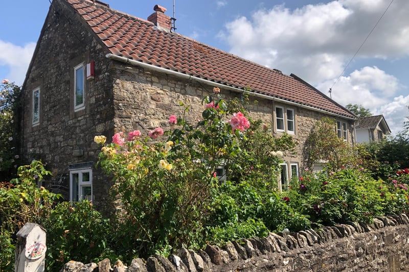 The narrow lanes in the village are lined with wonderful properties such as this rose-covered cottage in Church Street