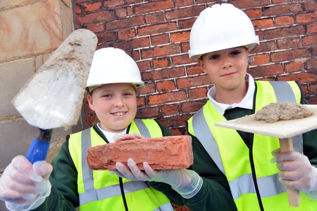 Hudson Road Primary School pupils Madie Jardine and Aaron Smith were ready to spring into action at the Holy Trinity Church restoration project in 2016.