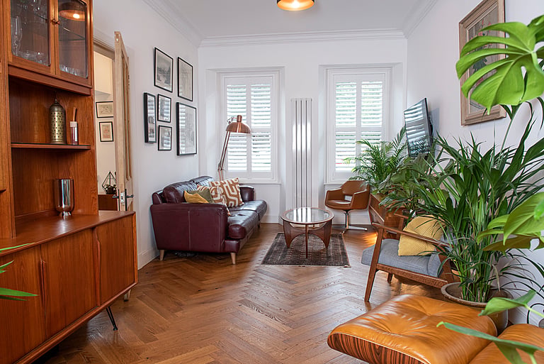 A former train station, the boarded up building laid empty for 10 years before the couple transformed it into a family home. Inside, the homeowners eclectic tastes can be seen as well as their desire to be sustainable with second hand furnishing adorning the three levels. There are nods to the building’s past including graffiti on the exterior garden walls, giving it a unique style.