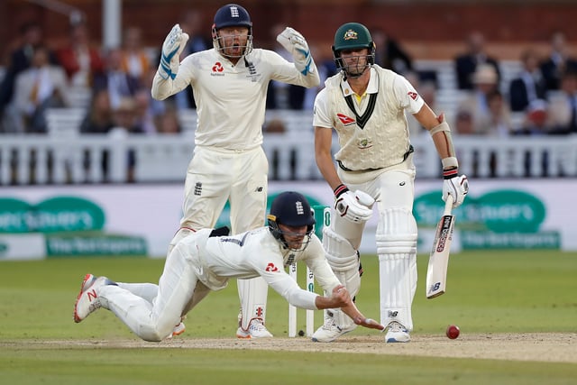 Rory Burns of England drops Pat Cummins of Australia off the bowling of Jack Leach of England during day five of the 2nd Specsavers Ashes Test between England and Australia at Lord's Cricket Ground on August 18, 2019 in London, England. (Photo by Ryan Pierse/Getty Images)