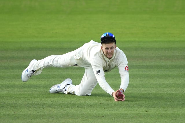 England captain Joe Root dives to catch Replacement batsman Marnus Labuschagne after it had hit Jos Buttler en route during day five of the 2nd Ashes Test match between England and Australia at Lord's Cricket Ground on August 18, 2019 in London, England. (Photo by Stu Forster/Getty Images)