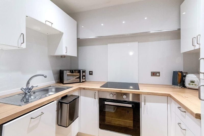 The modern re-fitted kitchen which has several built-in appliances. 