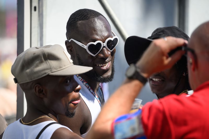 Stormzy walks from backstage into the public area ahead of a performance by Aitch on the Pyramid Stage on Day 4 of Glastonbury Festival 2023 