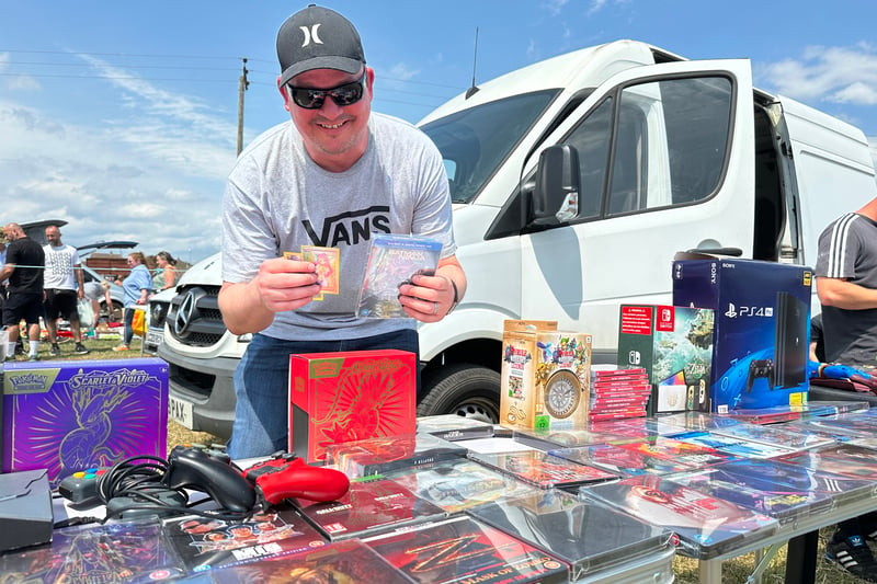 Shane Rushent has been at a car boot sale in Trowbridge in the morning, and appears at Marksbury for the afternoon. He’s selling everything from high-end Pokemon cards at £20 to 4k DVDs at £12. He buys to sell, and usually goes on eBay to trade but prefers the human interaction at a car boot sale. 