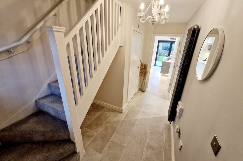 The hallway has direct access to the kitchen and the utility room and stairs to the first floor. Photo: Zoopla