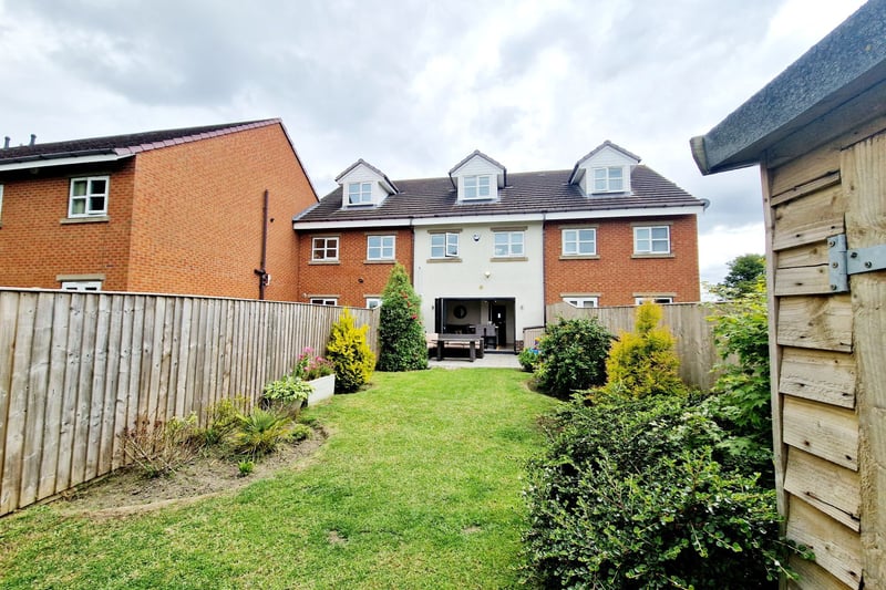 The rear garden offers privacy and ample space for family time. Photo: Zoopla
