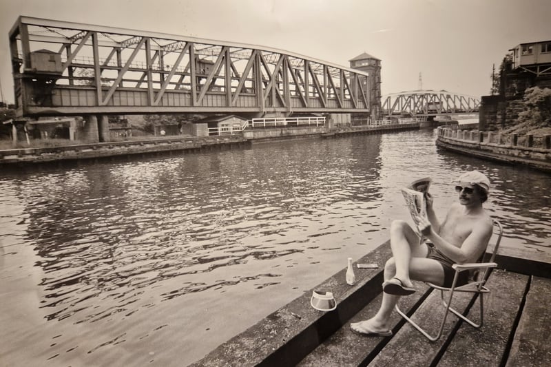 Pictured is Malcolm Morris who wrote a piece in the Lancashire Post about the tourism trade and how the Greater Manchester Weekender company was venturing into Manchester's industrial land with leisure tours. The bridge in the background is Barton Swing Bridge.
