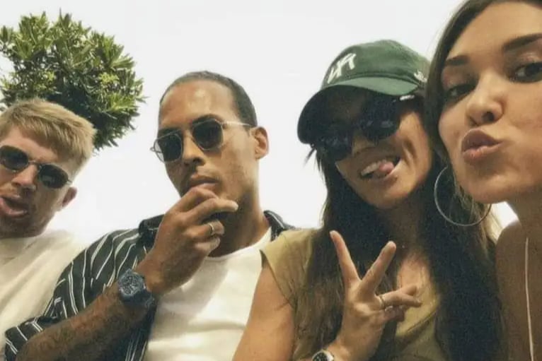 Virgil Van Dijk and Kevin De Bruyne put aside their club rivalry here as they are seen on holiday together here with their two wives.