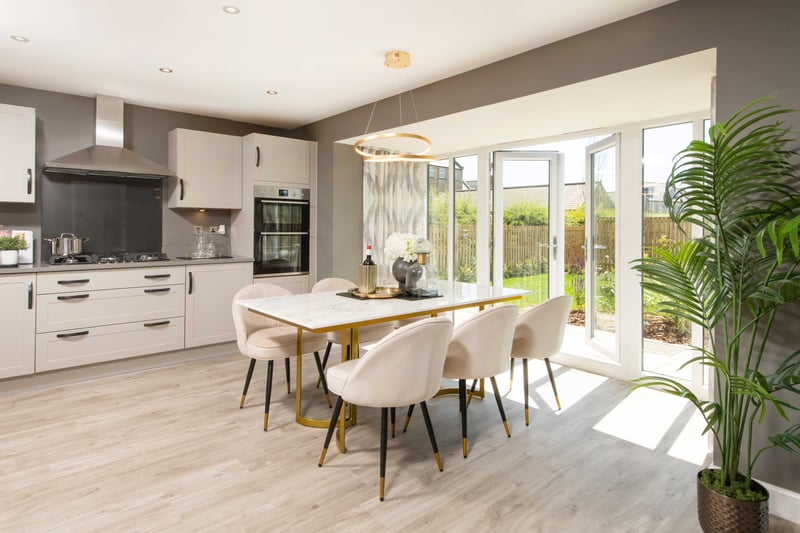 The kitchen with a walk-in glazed bay opening to the rear garden. Photo by David Wilson Homes