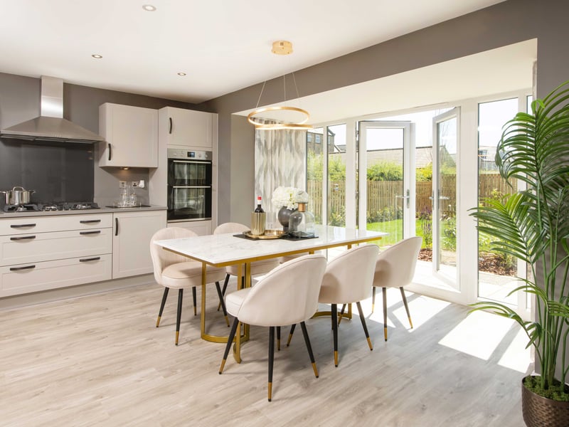 The kitchen with a walk-in glazed bay opening to the rear garden. Photo by David Wilson Homes