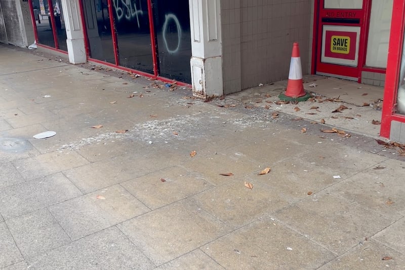 The pavements outside the old Iceland store are covered with pigeon mess