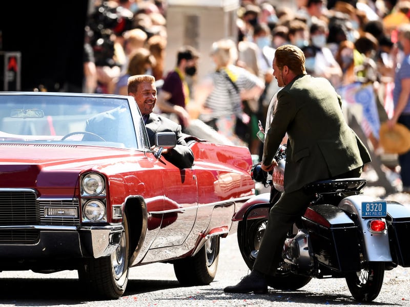 Cast members have a chat during a break in filming.