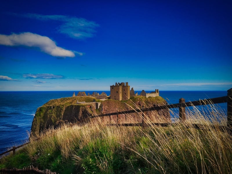 Dunnottar Castle sits atop a rocky outcrop along the Aberdeenshire Coastal Trail; 20 miles from Aberdeen and a mere 1.6 miles south of Stonehaven. The surviving buildings of the site are said to date largely to the 15th and 16th centuries. The castle is famous for playing an important role in the 18th-century Jacobite risings due to the strategic advantages of the location.