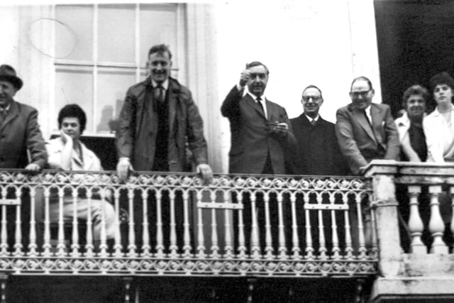 George Brown, Deputy Leader of the Labour Party, gives a thumbs up to the crowds below at Durham Miners' Gala in 1962. Next to him leaning on the balcony was Anthony Wedgewood Benn.