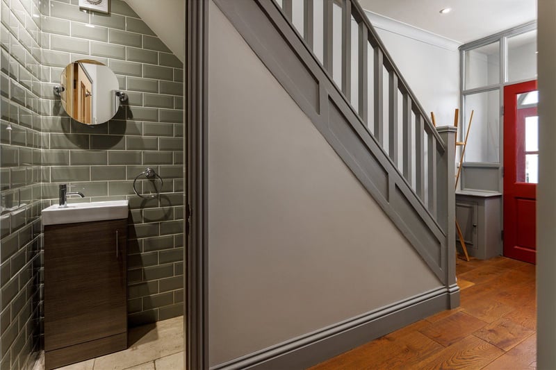 The modern entrance hall is instantly inviting - under the stairway you’ll find a handy cloakroom/WC.