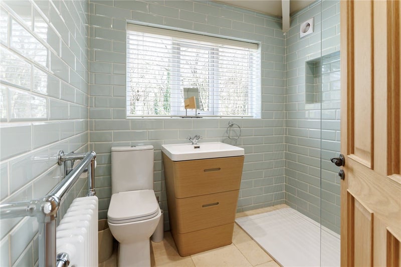 To the first floor is also an airy spa-like bathroom with walk-in shower.