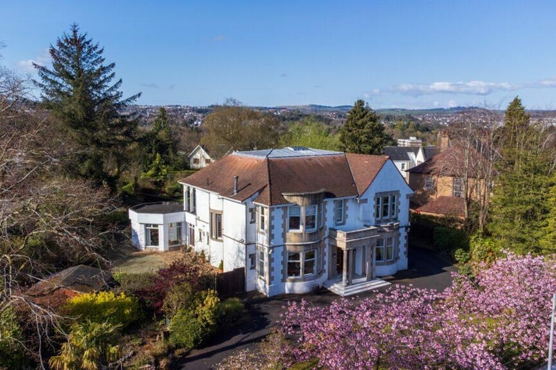 This detached villa can be found in Whitecraigs which is one of Glasgow’s most sought after neighbourhoods on the edge of the city. The property is surrounded with generous and landscaped gardens and includes five bedrooms. It’s on the market for £1,500,000. 