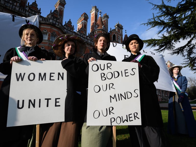 Royal Holloway came 29th. Pictured are students in 2018 re-creating a suffragette protest march. (Photo by Leon Neal/Getty Images)