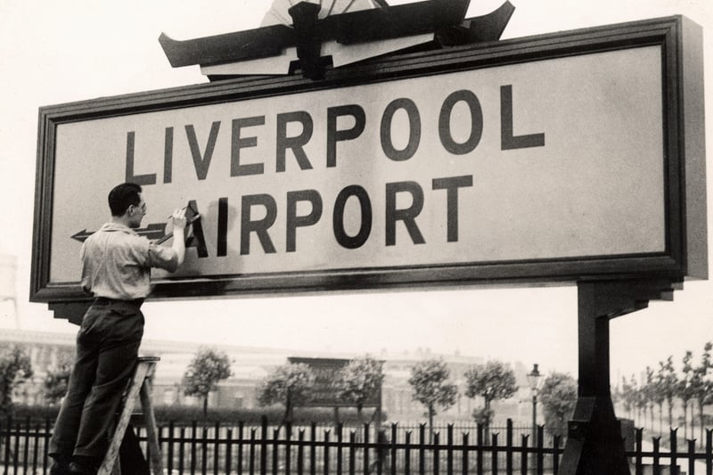 The original Liverpool Airport opened in 1933. Final touches to the sign.
