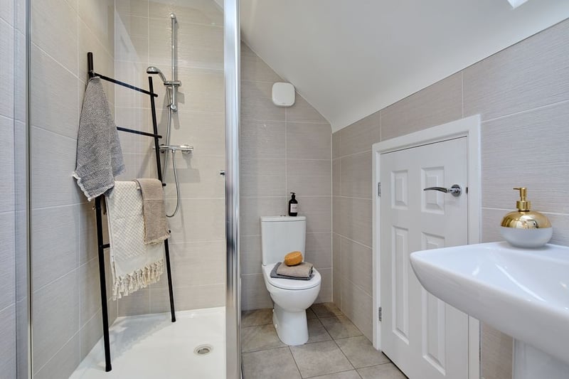 The master bedroom has its own ensuite bathroom with a shower.