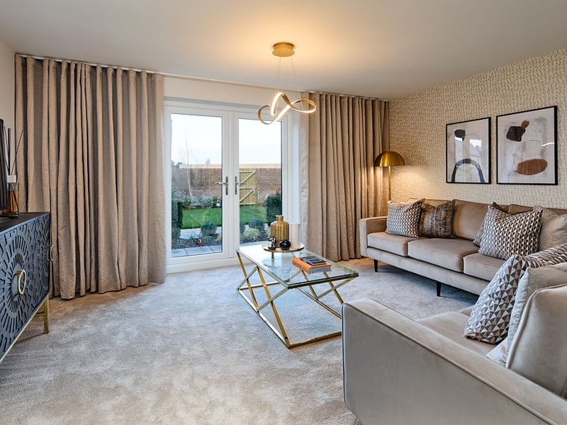 Large French doors in the lounge leads onto the rear garden.