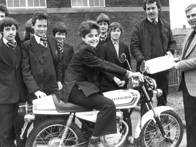 Stephen Pattinson was pictured on the motorcycle which was presented to Harton Comprehenive School, by Jos Conway's shop as part of the school's traffic programme. Peter Conway and headmaster John O'Neill are also in this 1980 photo. Photo: Shields Gazette