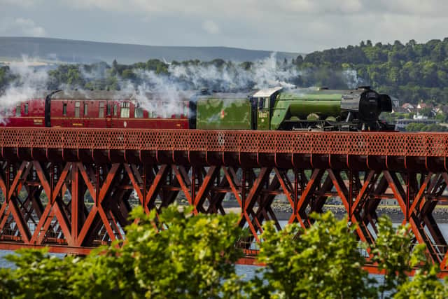 Flying Scotsman passes over the Forth Bridge as part of a series of events to celebrate her centenary. The world famous steam locomotive left Edinburgh heading north to Aberdeen.  Flying Scotsman passes over the Forth Bridge as part of a series of events to celebrate her centenary.  The world famous steam locomotive left Edinburgh heading north to Aberdeen.  