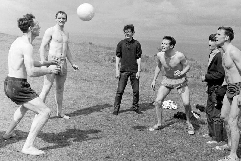 Members of Hearts football team during a training day at Gullane Beach. in East Lothian, in August 1965. Some local boys joined them for a game of keepie-uppie.