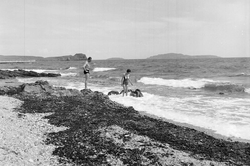 Holidaymakers brave the waves at Sandra Island, in Kintyre, in July 1961.
