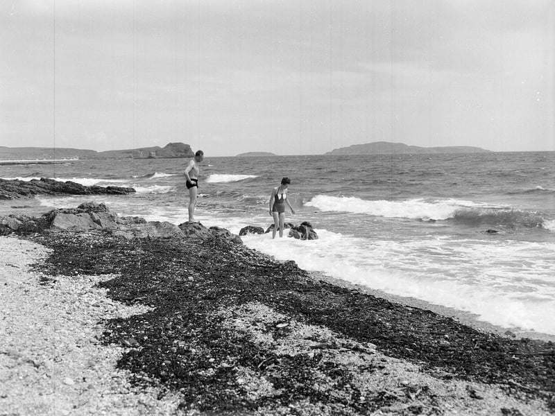 Holidaymakers brave the waves at Sandra Island, in Kintyre, in July 1961.