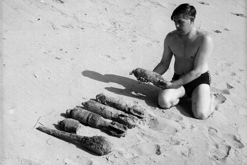 A beachcomber with bombs he found on the beach in Lunan Bay , in Angus, in August 1963.