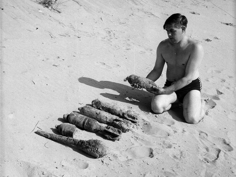 A beachcomber with bombs he found on the beach in Lunan Bay , in Angus, in August 1963.