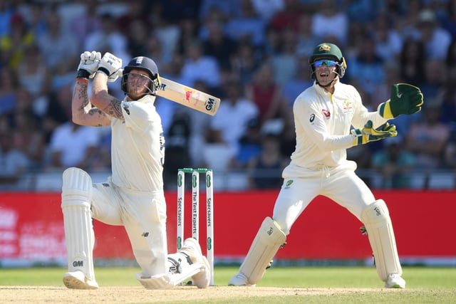 AUGUST 25: England batsman Ben Stokes hits a ball for 6 runs watched by Tim Paine during day four of the 3rd Ashes Test Match between England and Australia at Headingley on August 25, 2019 in Leeds, England. (Photo by Stu Forster/Getty Images)