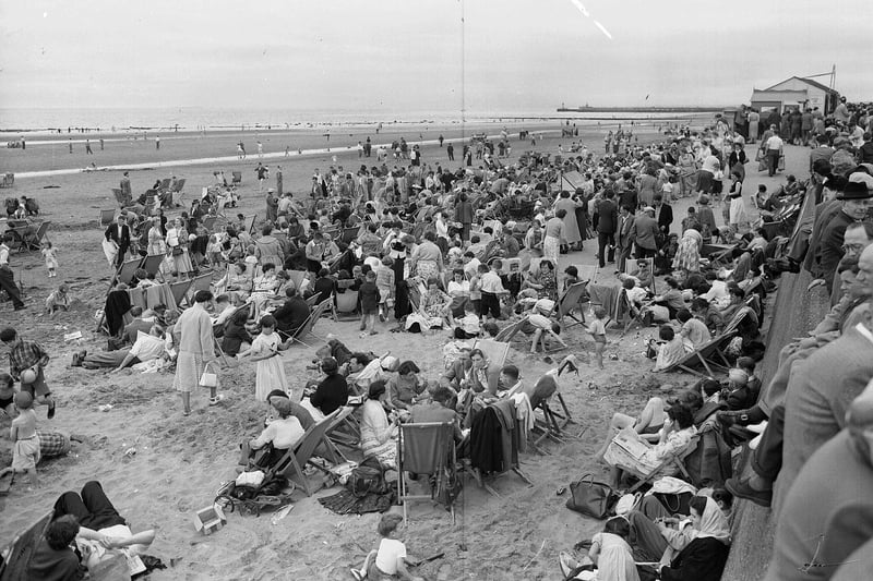 Visitors from Glasgow cram onto Ayr Beach in July 1955.