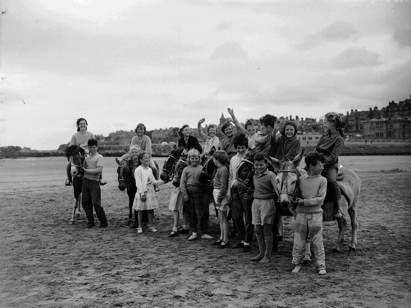 Children on donkeys on St Andrews beach in July 1961.