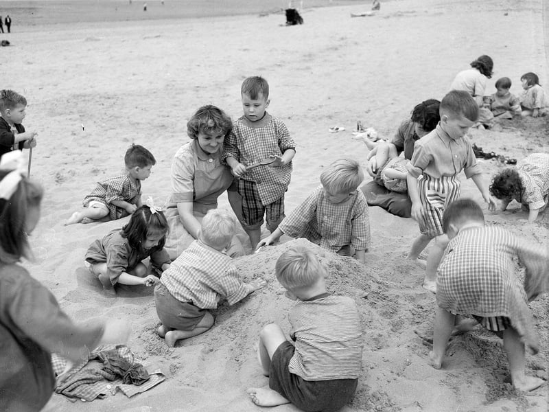 Children from Niddrie Day Nursery, in Edinburgh, during an outing to Gullane Beach in July 1959.