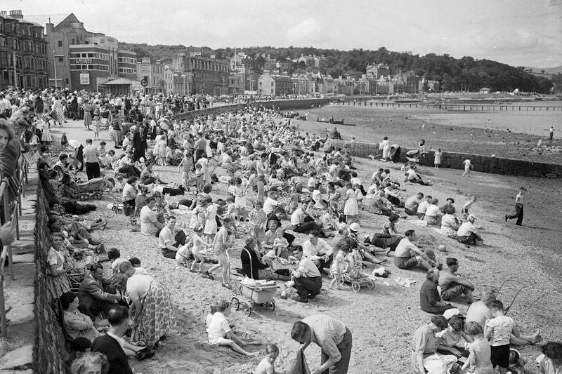 Holidaymakers crowd the beach at Rothesay, in the west of Scotland, in July 1955.