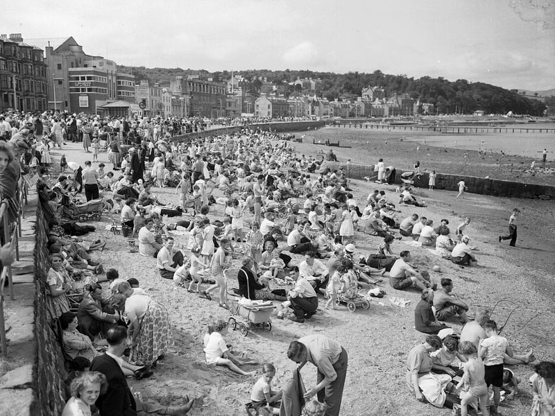Holidaymakers crowd the beach at Rothesay, in the west of Scotland, in July 1955.