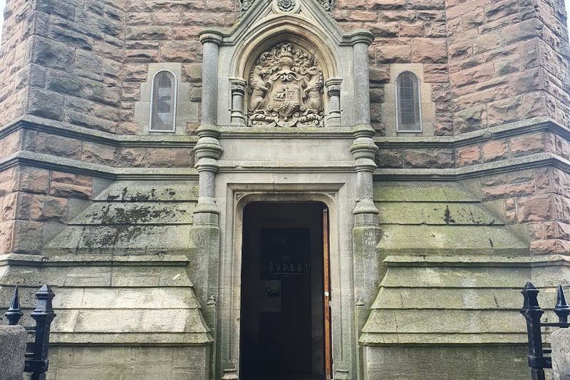 The entrance on the ground-floor of the Grade II-listed Cabot Tower, which was built from red sandstone and cream-coloured Bath stone