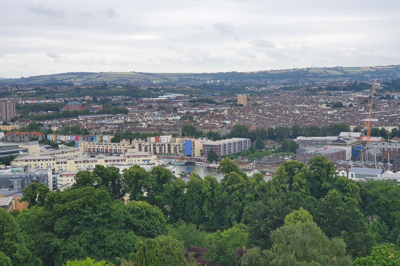 Beyond the trees at the bottom of Brandon Hill, the floating harbour is visible with south Bristol in the distance
