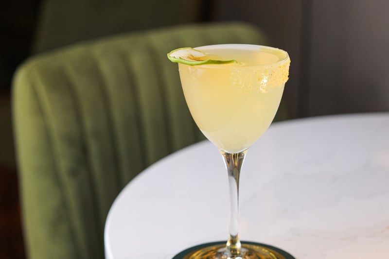 A classic margarita cocktail: Tapatio Blanco Tequila, Cointeau, live juice, tajin rim. 