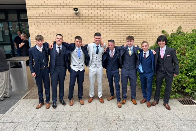 These group of boys pose together before a night at prom