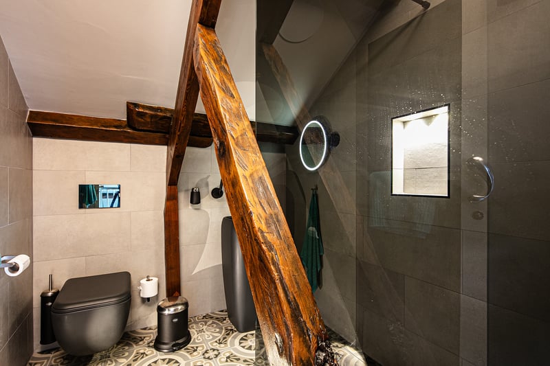 This second floor shower room blends contemporary excellently with the chapels original features.
