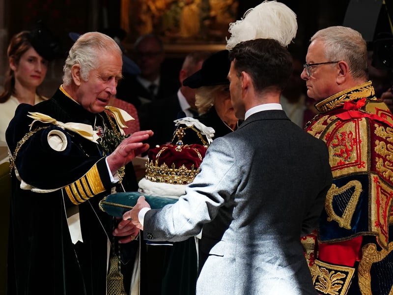 King Charles III is presented with the Crown of Scotland during the National Service of Thanksgiving and Dedication for King Charles III and Queen Camilla, and the presentation of the Honours of Scotland, at St Giles' Cathedral.