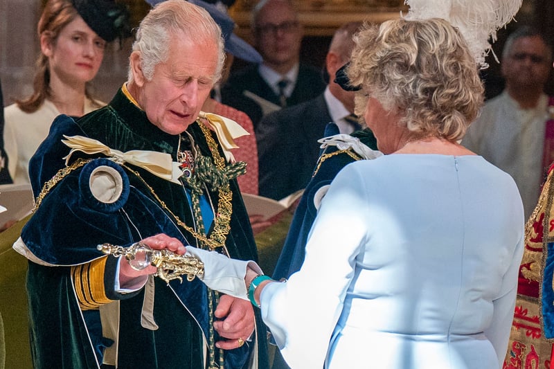 Britain's King Charles III is presented with the Sceptre by bearer Scotland's Lord Justice Clerk Leeona Dorrian.