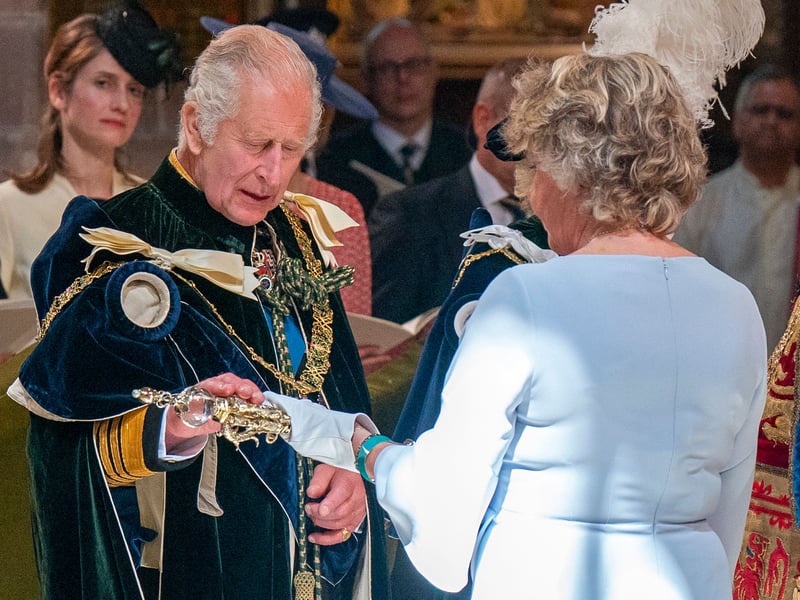 Britain's King Charles III is presented with the Sceptre by bearer Scotland's Lord Justice Clerk Leeona Dorrian.
