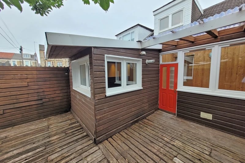 The enclosed rear garden with wooden decking