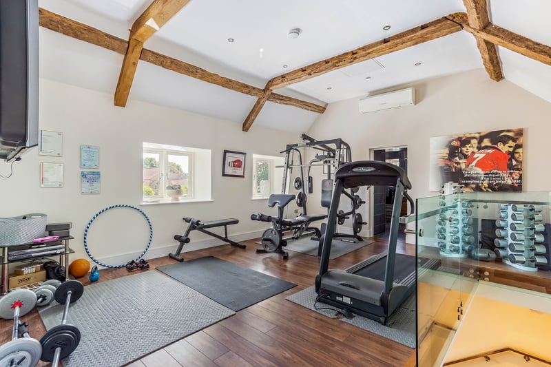 The gym is located above one of the many sitting rooms.