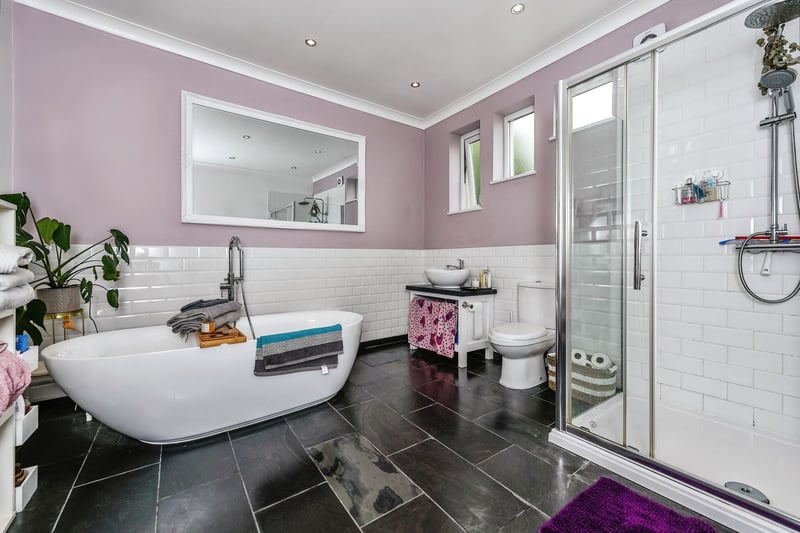 To the first floor is a luxurious family bathroom with stand-alone bath.