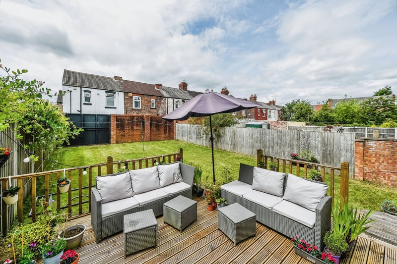 There is a large garden expanse with decking and a seated area, perfect for relaxing with family and friends or simply basking in the sunshine.